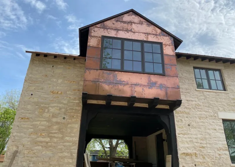 Copper metal panel facade on a stone building for Skylight Installation in Cusseta-Chattahoochee County